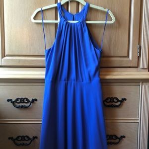 A cornflower blue dress that goes around the neck